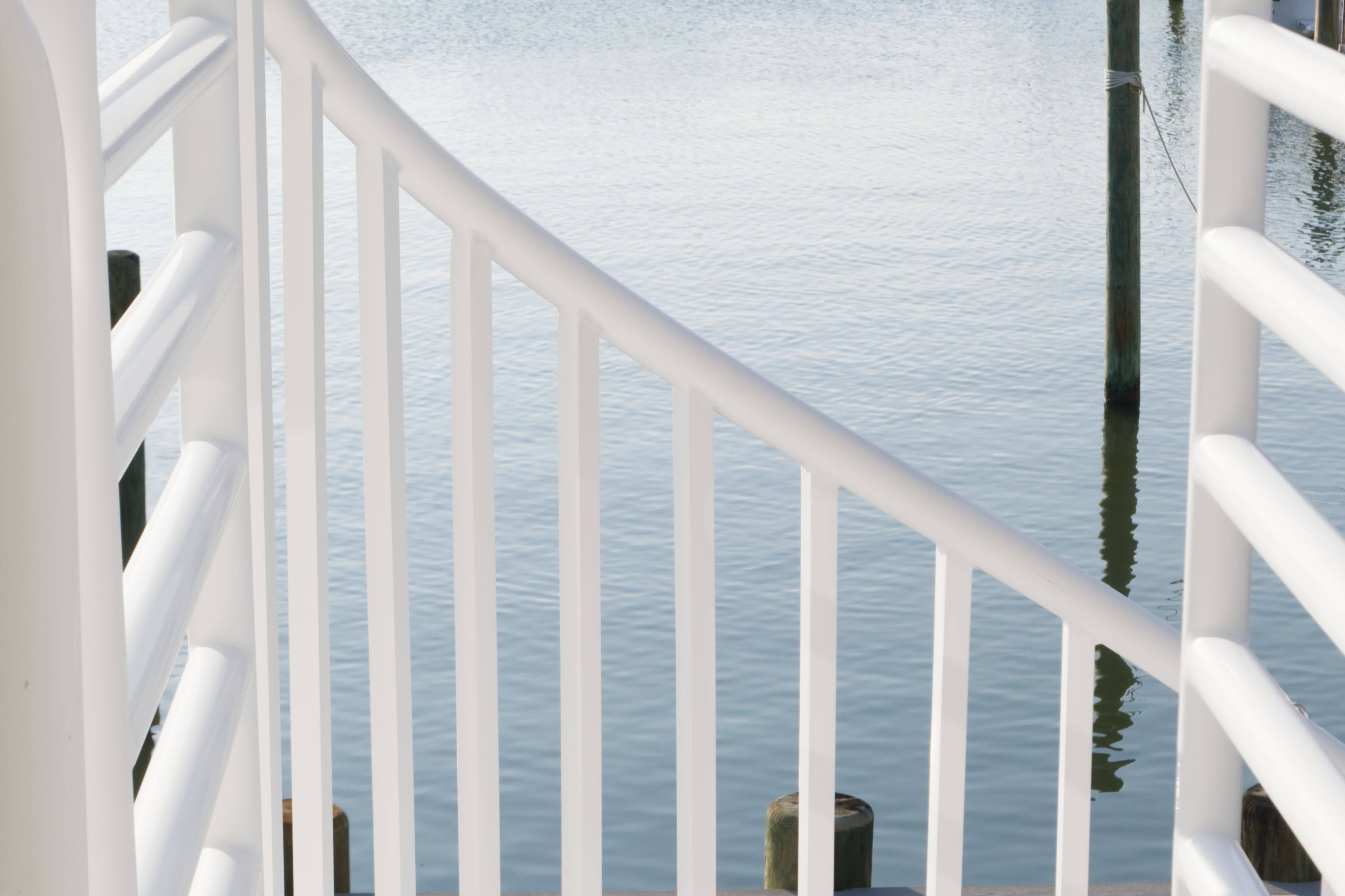 A color photo of a spiral staircase railing overlooking the bay in beach haven, New Jersey. The tight crop gives this photo an abstract feel. 