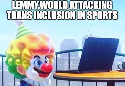 Clown Mario looking at laptop "LEMMY.WORLD ATTACKING TRANS INCLUSION IN SPORTS"