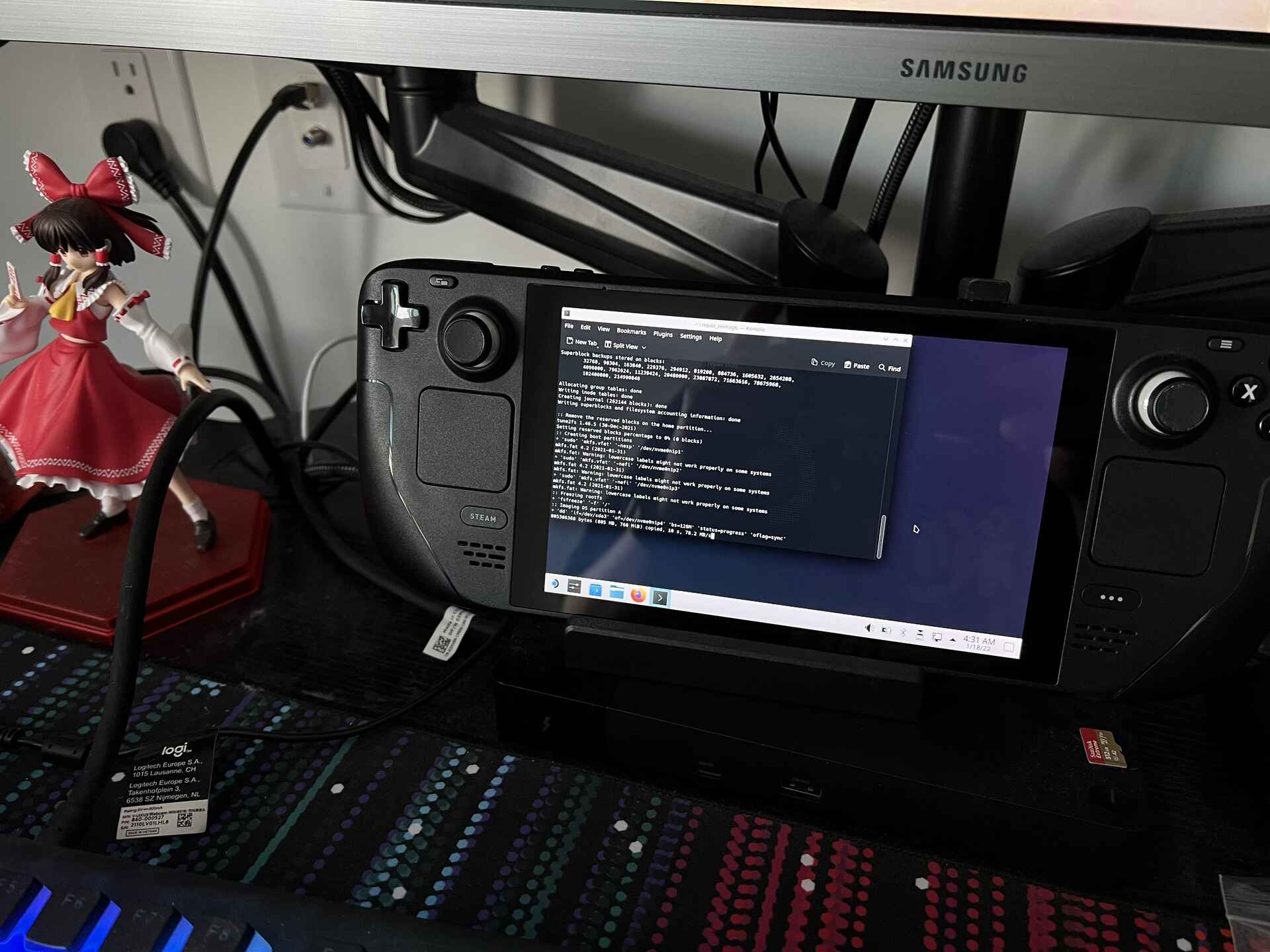 A photograph of a steam deck performing the re-imaging, re-installing the Operating System from a USB stick.