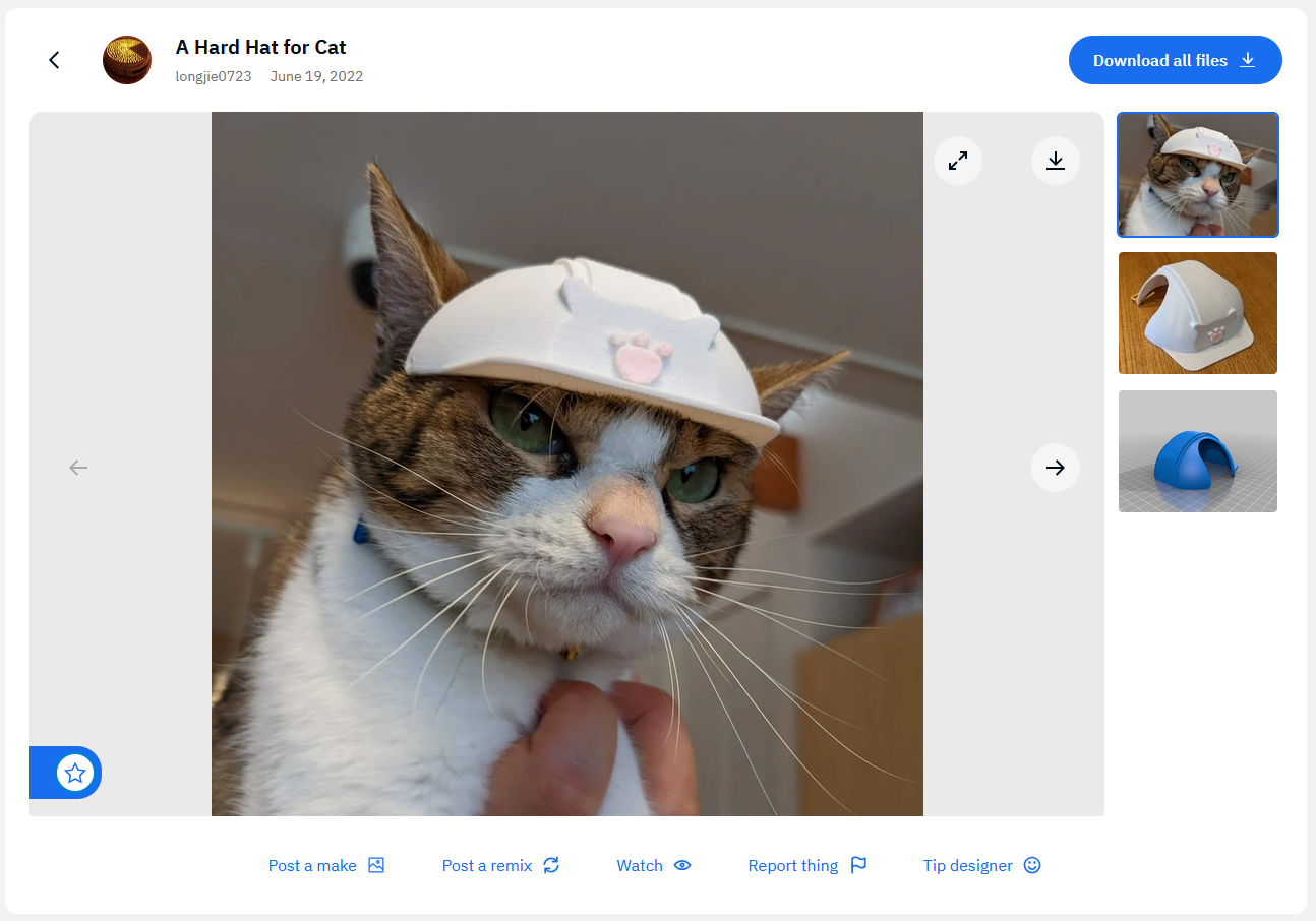 Thingiverse post for a 3D-printable hard hat for cats. Title: A Hard Hat for Cat. The first preview image shows a cat wearing an example hard hat. It looks severely pissed off. The other two preview images show the example hard hat by itself and one of the parts of the 3D model.