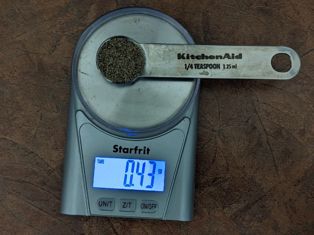 1/4tsp on black pepper being weighed on a scale, it reads 0.43g