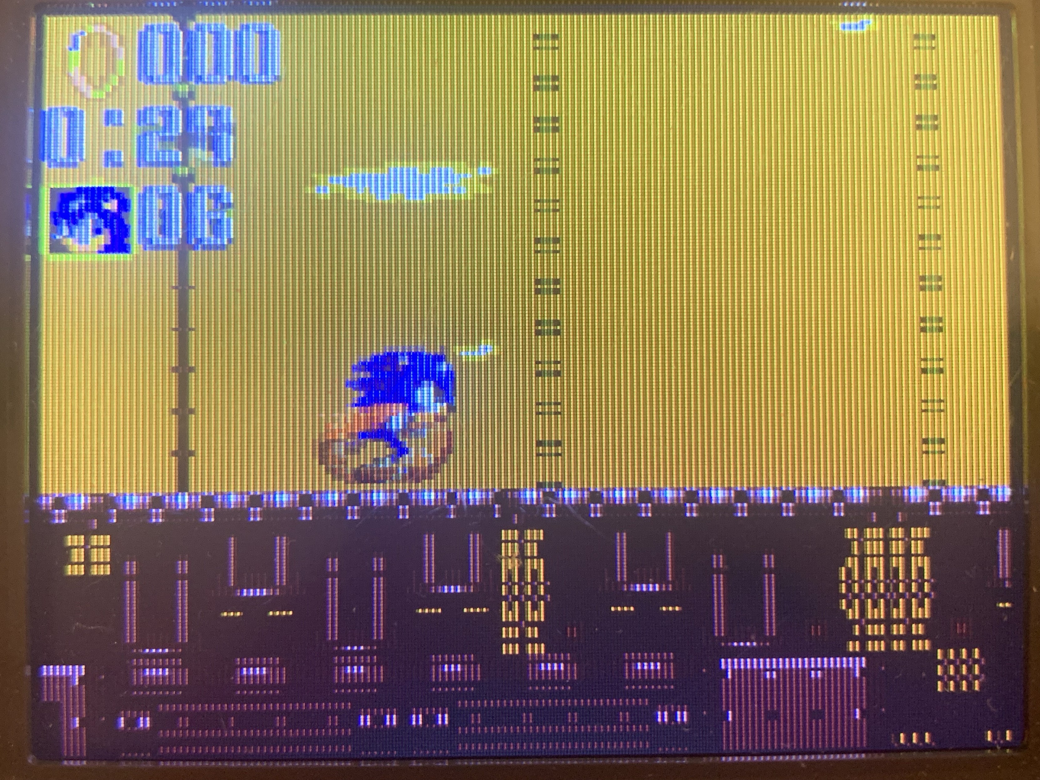 Sonic is speeding up in an industrial looking level. 