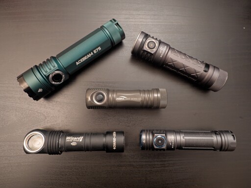 Five flashlights on a dark background