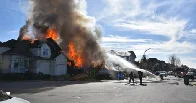 Woman still unaccounted for after home explosion, fire in Langley, B.C.