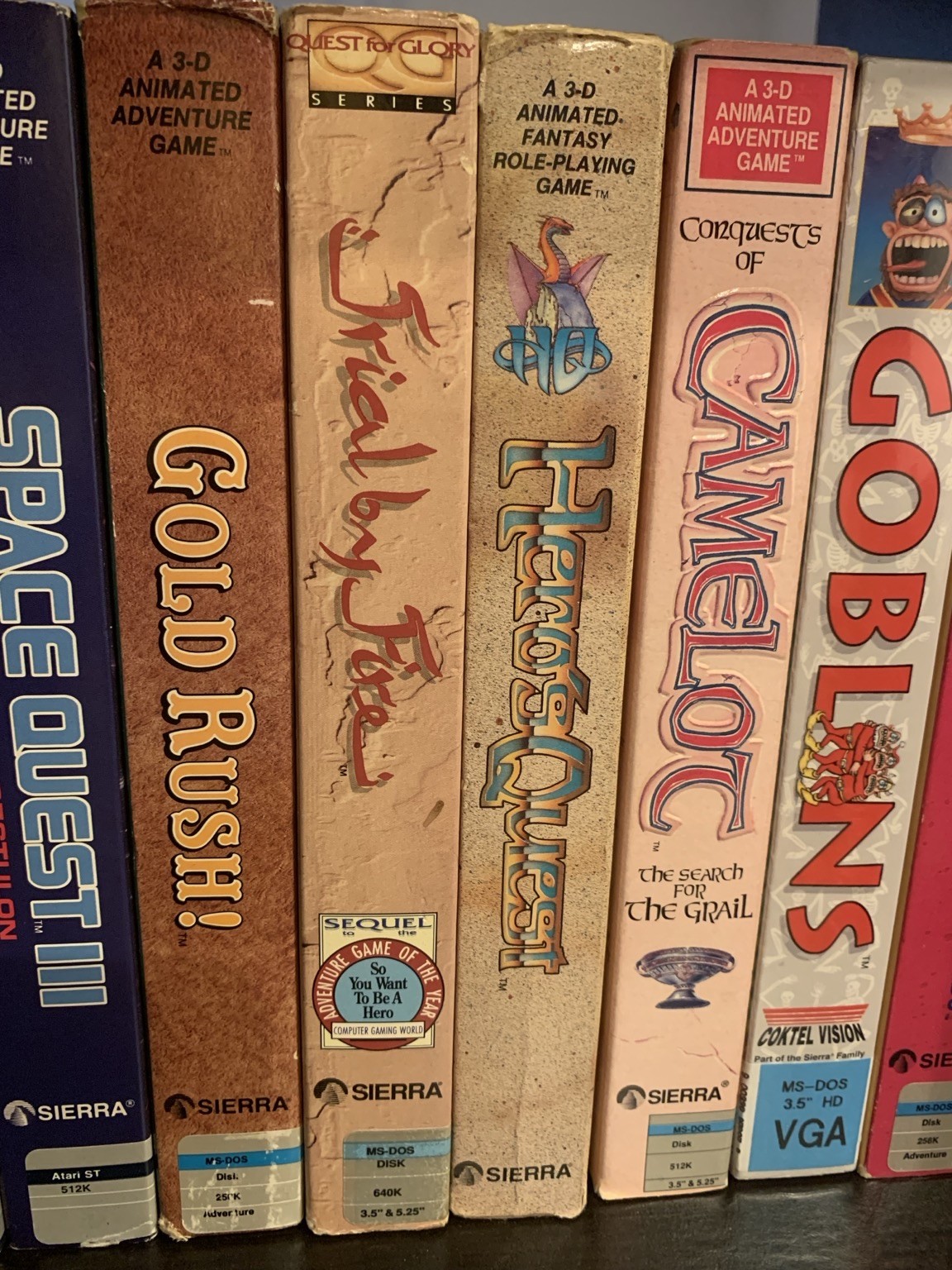 Multiple Sierra adventure game boxes. Space Quest, Quest for Glory, Conquest of Camelot, Gold Rush, Gobliiins. 