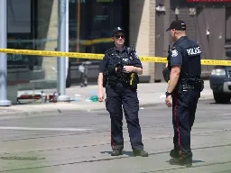 Woman, 40, killed in daytime Toronto shooting, police searching for two suspects