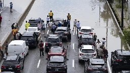 A major highway and roads are flooded as torrential rains hit Canada's largest city