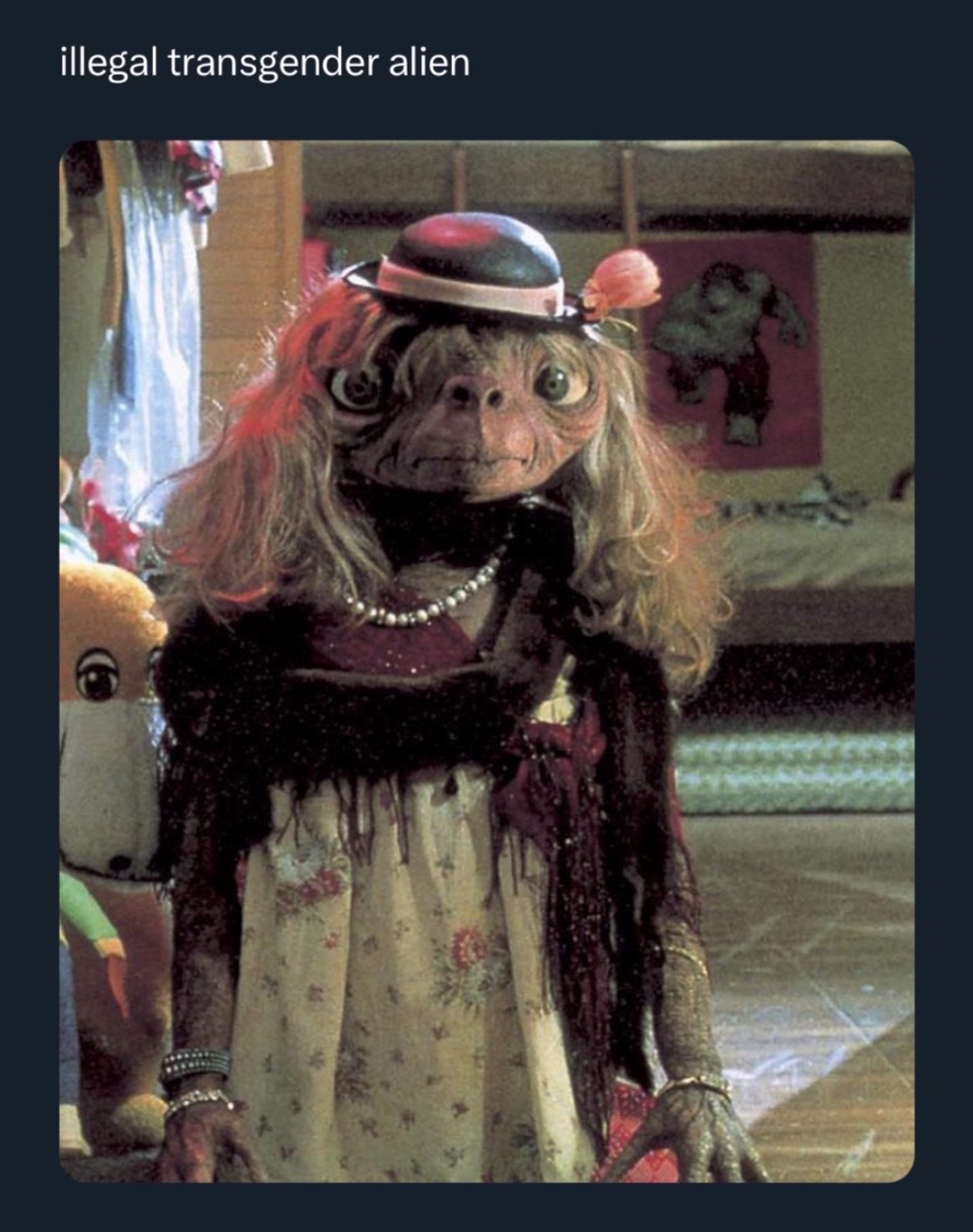 A screenshot of ET from the 1982 movie dressed as a girl