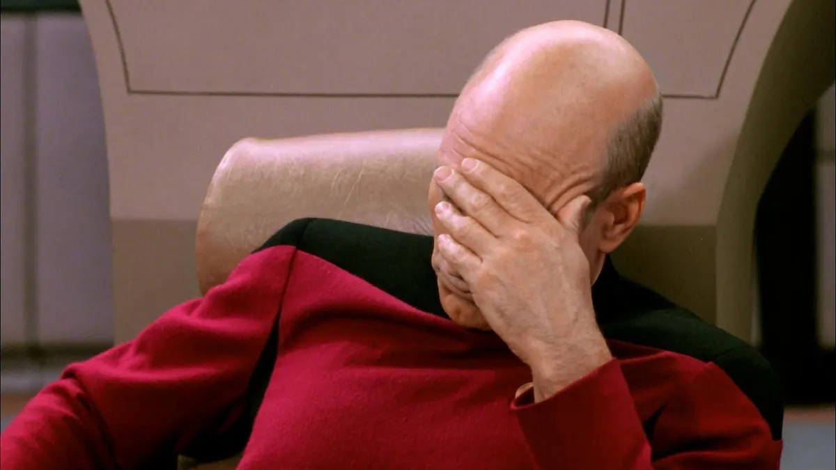 Patrick Stewart as Captain Picard in Star Trek, facepalming